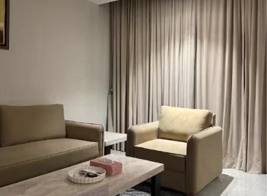 Seating area with armchair and sofa